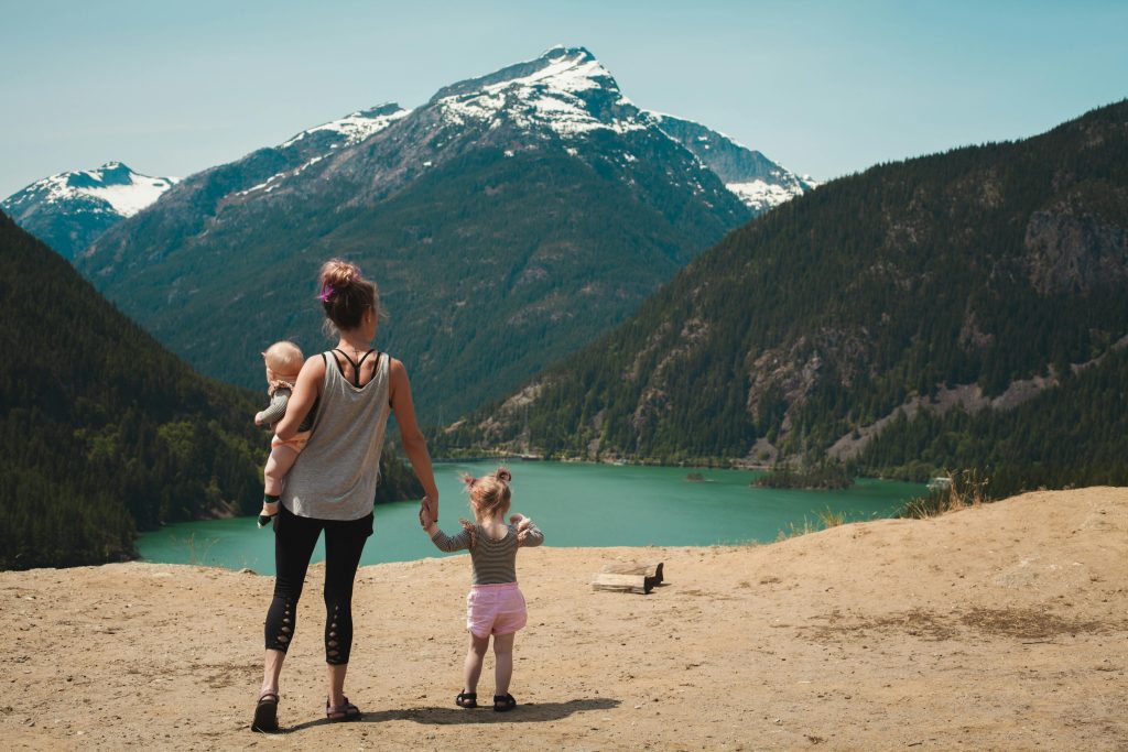 Image of mother and children exploring the outdoors
