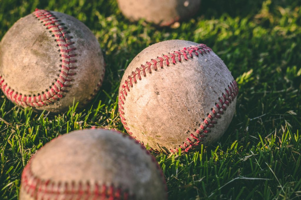Decorative photo of baseballs on the ground
