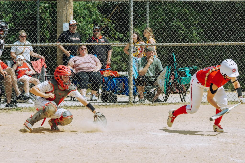 Image of parents and kids at the ballpark
