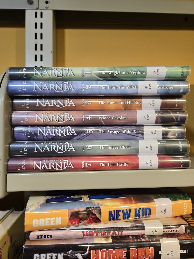 photo of the spines of all seven chronicles of narnia book series titles